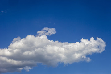Naklejka na ściany i meble Blue sky background with clouds close-up