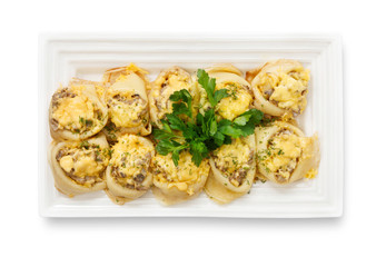 Platter of pancakes with meat filling, isolated on white