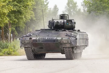 Foto op Aluminium German infantry fighting vehicle drives on a street © filmbildfabrik
