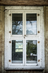 Old wooden windows with peeled paint
