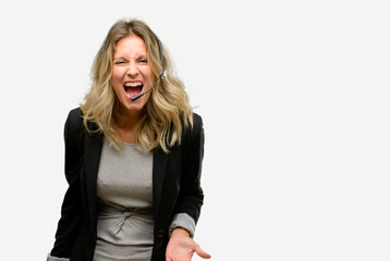 Young woman operator from call center stressful, terrified in panic, shouting exasperated and frustrated. Unpleasant gesture. Annoying work drives me crazy