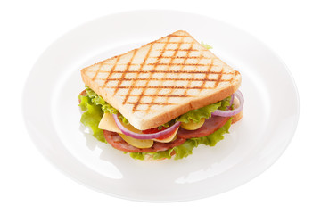The sandwich with sausage is served on a plate. Isolated on white background.