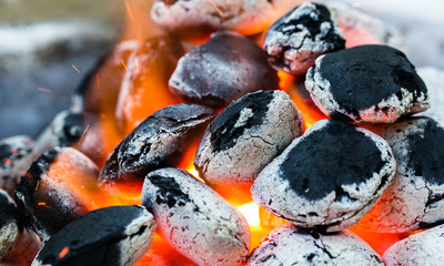 Arranged coals (selective focus) ready for barbecue