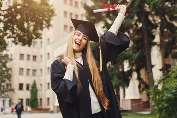Happy young woman on her graduation day