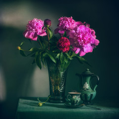 still life with flowers and a cup of coffee. a bouquet of peonies. vintage.