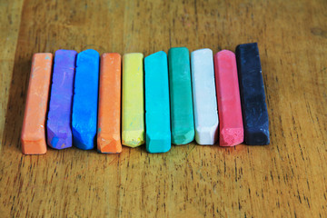 colored chalk on a wooden table