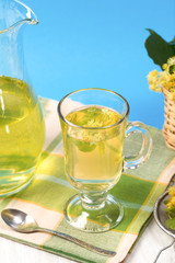 Cup of linden tea near of carafe