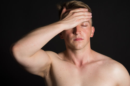 Headache. Black Background. Attractive Guy. 