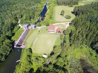 Fototapete Kanal Giant concrete lock Piaski (Sandhof) in Guja - part of the Masurian Canal which was intended to connect the Great Masurian Lakes with the Baltic sea, Mazury, Poland (former East Prussia)