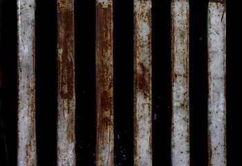 Texture of metal with rust grate off the drain.