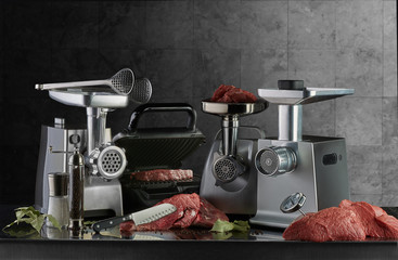 Electric meat grinders and electric grill ready for meat