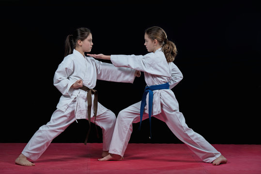 Children are training karate blows