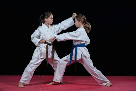 Children are training karate blows