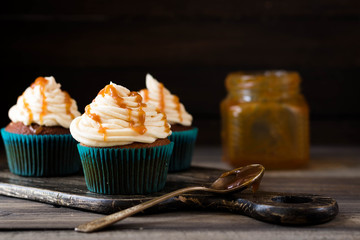 Caramel cupcakes on a dark background