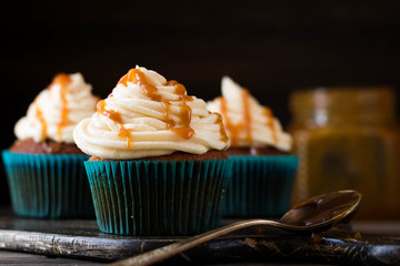 Caramel cupcakes on a dark background