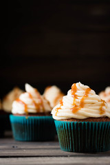 Caramel cupcakes on a dark background