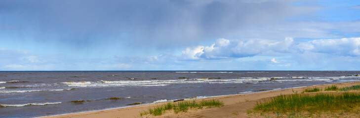 Panoramic seascape, beach with ocean waves, skyline and clouds 