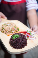 Spicy minced pork salad served with rice berry
