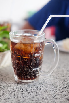 A fresh glass of soft drink with ice