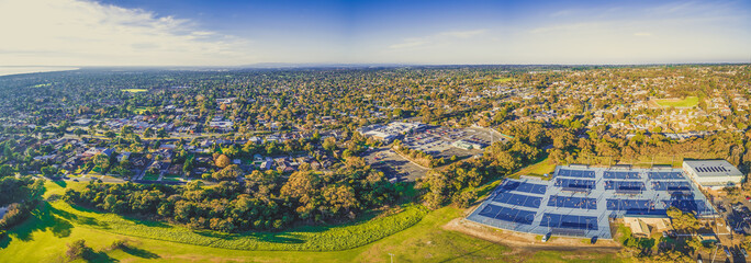 Aerial panorama of Frankston suburb and netball courts in Jubilee park in Melbourne, Australia