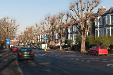 London suburb neighborhood urban brick house road trees
