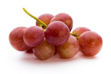 Ripe red grape isolated on white.