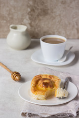 Cottage cheese casserole with honey on white plate. Cottage cheese baked pudding.