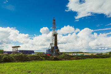 Land oil drilling rig blue sky