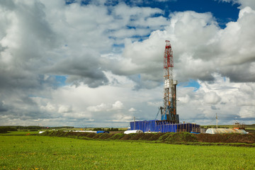 Land oil drilling rig blue sky