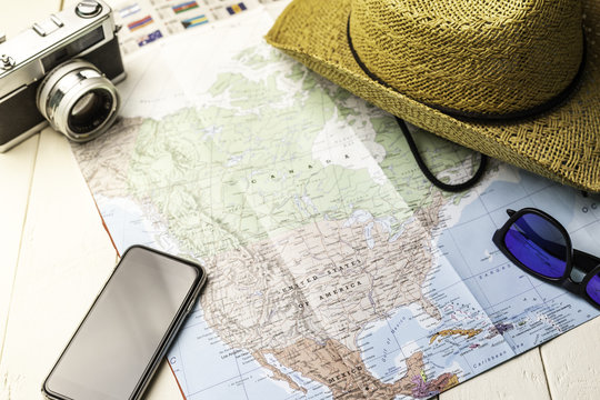 Background accessories for traveling with america map, photo camera etc.