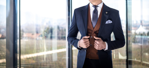 Fototapeta Man in custom tailored suit posing indoors obraz