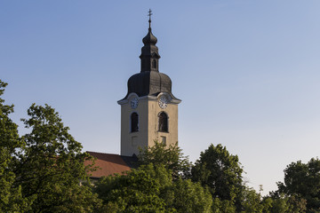 Fototapeta na wymiar The Ozalj church bell tower. Church is located on top of the hill.