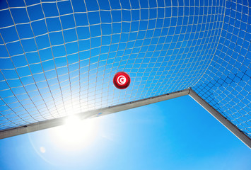 Fussball mit tunesischer Flagge
