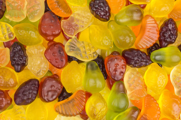 background of gummy candy with different fruit flavors