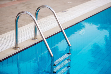 Metal staircase for exit from the pool