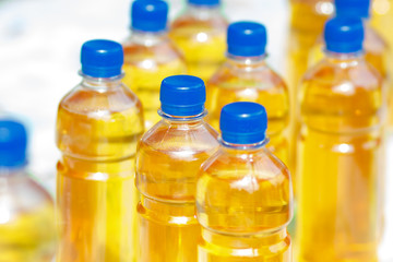Plastic bottles with yellow sweet liquid drink