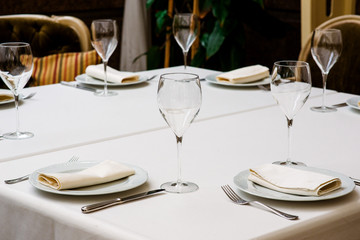 Table setting with an empty glass for wine.