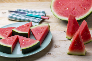 watermelon pieces in a wooden background