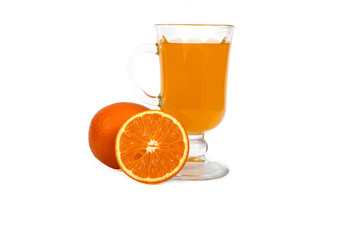 Fresh orange juice with mint in a glass cup isolated on white background. Fresh oranges and juice on a white background, view of the shu, cospore space.