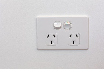 Modern Australia double power outlet on white wall
