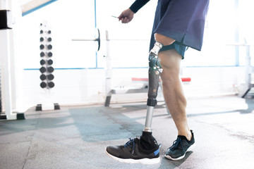 Close-up of athlete with an amputated leg skipping rope