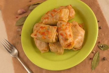 Cabbage leaves with filling, tomato sauce - european food. Top view. 
