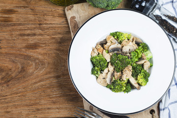 Stir fry with chicken, mushrooms and broccoli low carb high protein recipes. Healthy fat burning eating concept.