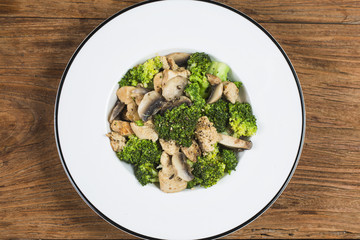Stir fry with chicken, mushrooms and broccoli low carb high protein recipes. Healthy fat burning eating concept.