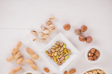 healthy snack selection on white wood background