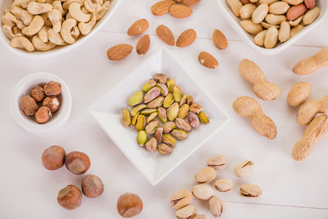 healthy snack selection on white wood background
