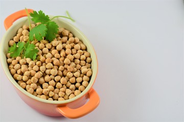 Chickpeas in a bowl on a white background