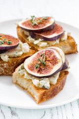 toast with figs and blue cheese, vertical closeup