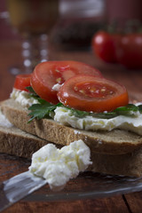 Sandwich toast bread for breakfast with cheese and orange juice, tomatoes, lettuce