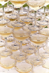 Champagne glasses standing in a tower at a festive event, party or wedding reception. Champagne...